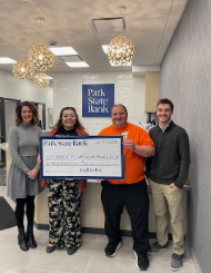 Park State Bank employees giving a check to Head of the Lakes United Way employees.